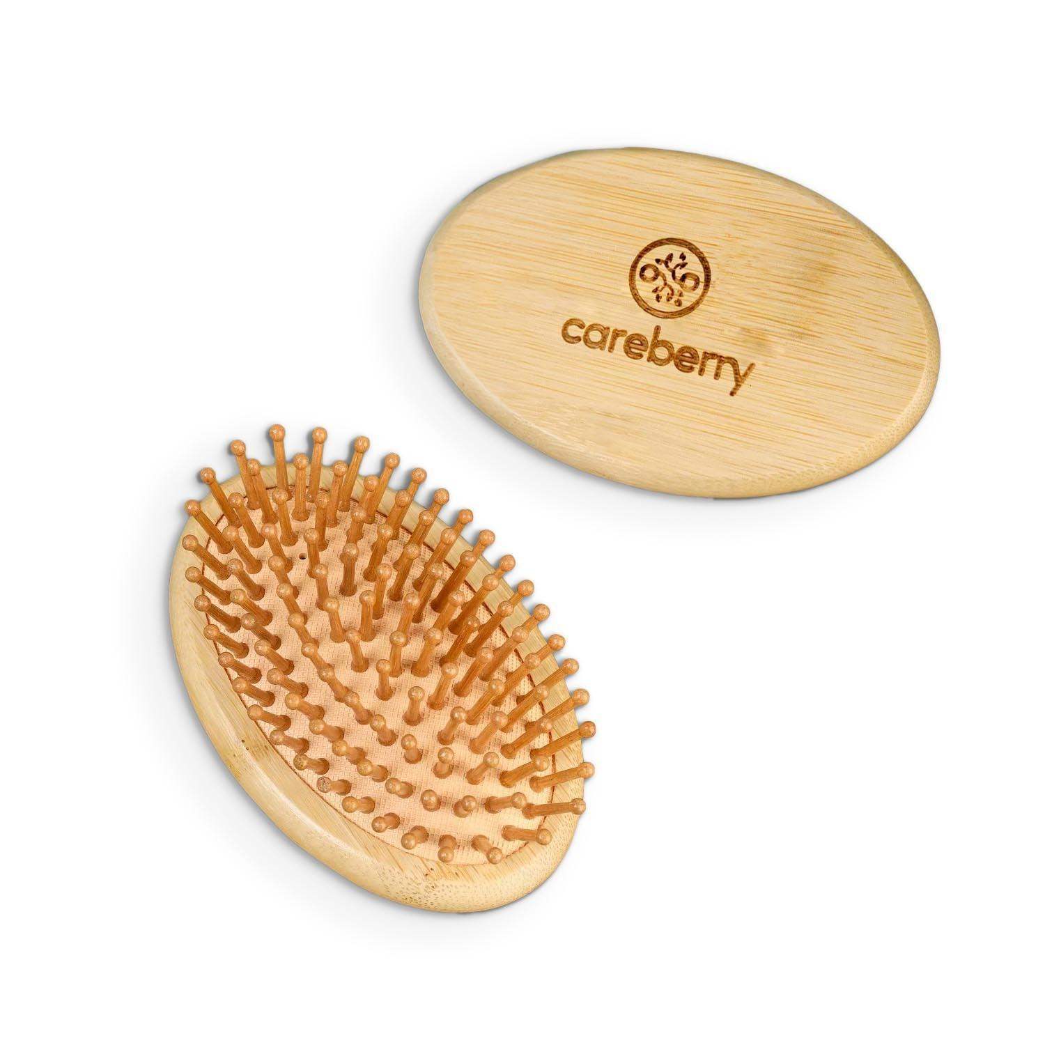 Careberry natural mini wooden hair brush with round bristle head and bamboo handle on warm beige background, portable grooming tool.